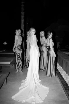 black and white photograph of women in evening gowns