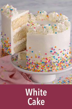 a white cake with sprinkles on it and the words, white cake