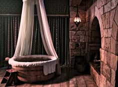 an old fashioned bathtub in the corner of a room with a canopy over it