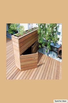 a wooden deck with planters on it and plants growing out of the bottom part