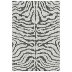 an animal print rug with black and white stripes