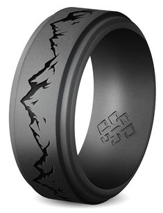 a black ring with an intricate design on it