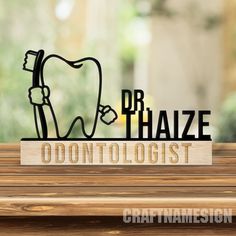 a wooden table with a sign that says dr haze on it and an image of a toothbrush