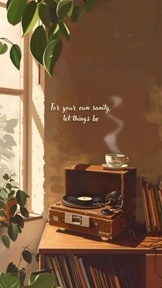 an old record player sitting on top of a wooden table next to a potted plant