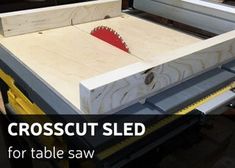 a close up of a table saw with the words crosscut sled on it