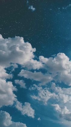 the sky is filled with clouds and stars