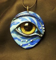 a necklace with an eye painted on it