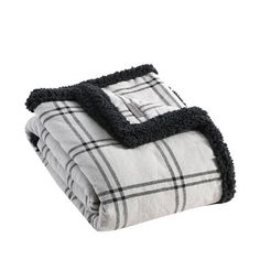 a blanket with black and white plaid on it