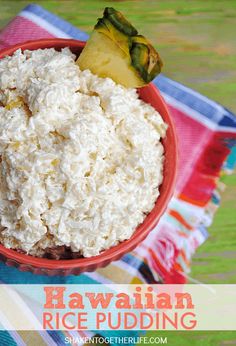 rice pudding in a red bowl on a colorful table cloth with a pineapple and text overlay that reads hawaiian rice pudding