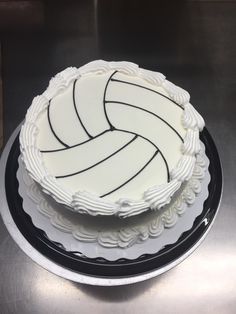 a white cake with black lines on it