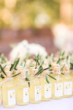 olive oil bottles are lined up on a table