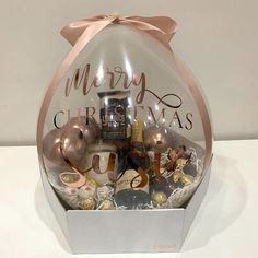 a christmas gift box filled with champagne and chocolates