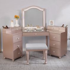 a vanity with stool and mirror in a room