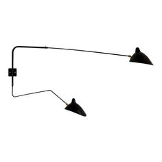 two black lamps on a white background with one light turned off and the other turned down