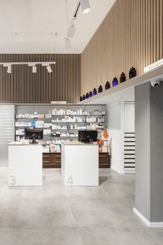 the inside of a store with shelves and counter tops