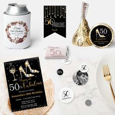 50th birthday party items including champagne, chocolates and personalized cards for someone's 50th