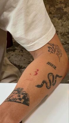 a person with a tattoo on their arm