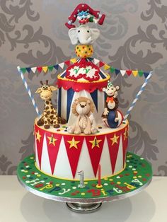 a circus themed cake with animals on top