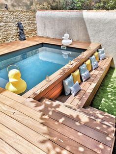 an outdoor hot tub surrounded by wooden decking