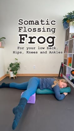 a woman laying on the floor in front of a wall decal that says, somatic flossing frog for your low back tips, knees and ankles