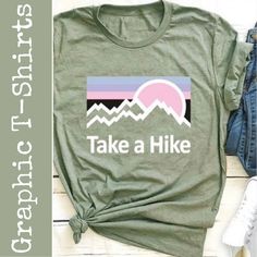 Take A Hike Round Neck T-Shirt Color: Green Size: X-Large Material: 65% Cotton And 35% Polyester Care: Hand Wash Cold Water (See Label Instructions) Length: Approximately 28” Pit To Pit: Approximately 21.5” Ii0614 Green Graphic Tee For Outdoor, Casual Green Tops For Outdoor Activities, Green Graphic Tee For Outdoor Activities, Casual Slogan T-shirt For Outdoor, Summer Graphic Print Tops For Outdoor Activities, Graphic Print Tops For Outdoor Summer Activities, Casual Logo Print Tops For Outdoor, Graphic Print Tops For Summer Outdoor Activities, Casual Tops With Logo Print For Outdoor