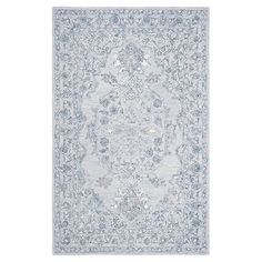 a blue and white rug with an ornate design on the bottom, in front of a white background