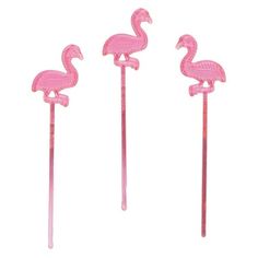 three pink flamingos are standing next to each other on the same long metal stick