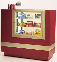 a red and gold colored display case with sodas on the top, snacks in the bottom