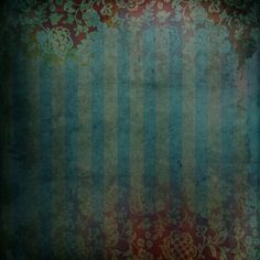 an old wallpaper with stripes and floral designs on it, in shades of blue and red