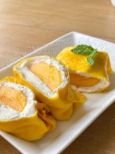 some kind of food that is on a white plate and sitting on a wooden table