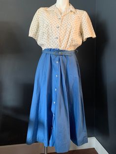 "This is one of those June Cleaver type dresses that is in wonderful condition for the vintage age it is in. The ten button front closure gives a sort of nautical feel to the blue and off-white design. The belt has damage but is still in one piece. (Pictured). The shoulders have a small pad in them and there is some discoloration to the material. 17\" bodice from shoulder to waist 29\" waist to hem 26\" waist  15\" shoulders 9.5\" sleeve 41\" across hem flat" Summer Vintage Blue Dress, 40s Summer Fashion, Blue Vintage Summer Dress, 1940s Everyday Fashion, Vintage Dress With Button Closure For Work, American Vintage Outfits, Blue Vintage Dress With Buttons For Vintage Fashion, Blue Vintage Dress With Buttons, Vintage Workwear Dress With Button Closure