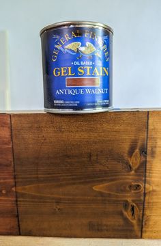 a can of gel stain sitting on top of a piece of wood