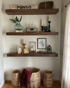 some shelves with baskets and pictures on them