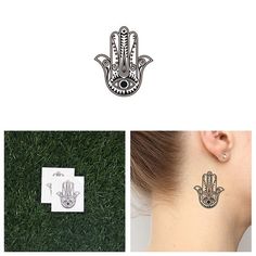 the ear is decorated with an image of a hamsa hand