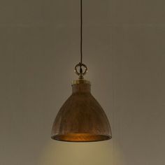 a wooden light hanging from a ceiling in a room with white walls and flooring