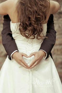 a woman in a wedding dress is holding her hands together with the words interest written on it