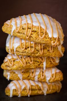 a stack of three cookies with icing on top