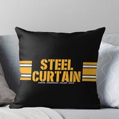 a black and yellow pillow with the words steel curtain on it