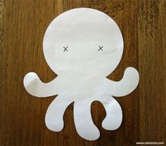 an octopus cut out on a wooden table