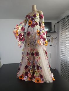 a dress made out of flowers is on display