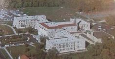 an aerial view of a large white building