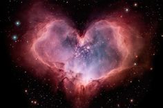 a heart shaped object in the middle of space