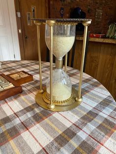 an hourglass sitting on top of a table