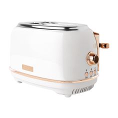 a white toaster with gold trimmings on the front and side, sitting against a white background