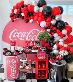 a coca cola themed party with balloons and desserts