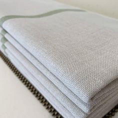 four folded towels sitting on top of each other