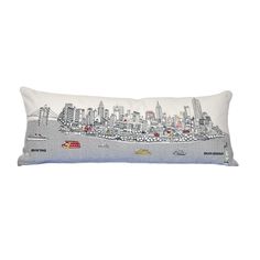 a pillow with a city skyline on it