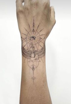 a person's arm with a tattoo on it and an eye in the middle