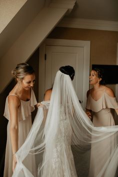 two bridesmaids are getting ready for their wedding