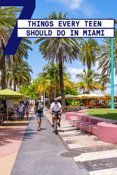 two people riding bikes down a sidewalk next to palm trees and buildings with the words 7 things every teen should do in miami